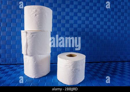 Stacked rolls of toilet paper representing hoarding because of Covid-19 Stock Photo