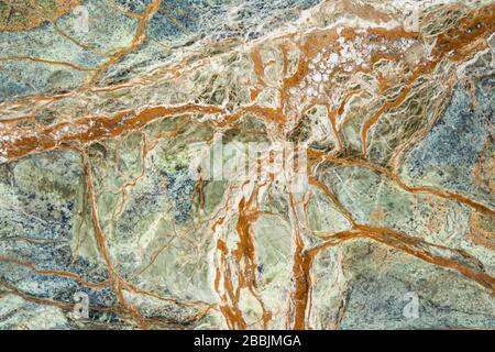Beautiful multicolored natural marble with abstract pattern. Natural marble bacground. Stock Photo