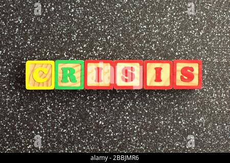 Word CRISIS made from color wooden letters. Economy and Financial crisis concept Stock Photo