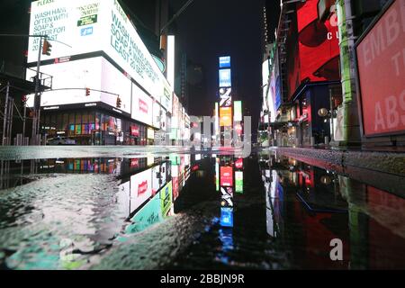 March 28, 2020, New York, NY, United States: An empty Times Square on a rainy night during the COVID-19 or novel coronavirus crisis. (Credit Image: © Dan HerrickZUMA Wire) Stock Photo