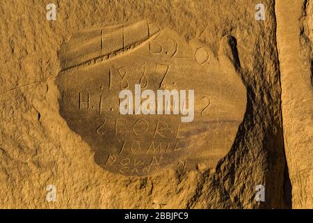 Historical inscriptions from 1887, along the Petroglyph Trail in Chaco Culture National Historical Park, New Mexico, USA Stock Photo