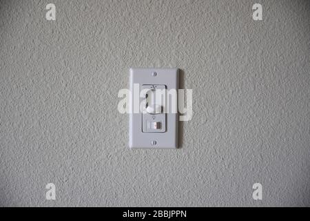 3 Speed White Wall Mount Universal Ceiling Fan Remote Control Stock Photo