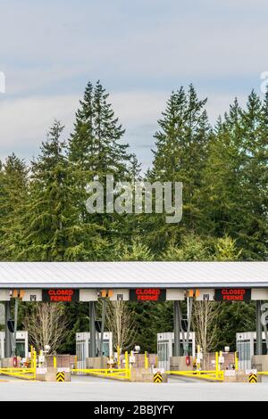 Surrey, Canada - March 29, 2020: Empty inspection stations at closed Peace Arch Canadian border entrance during Coronavirus Covid-19 outbreak