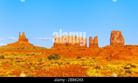 The sandstone formations of Mitten Buttes and Cly Butte in the desert landscape of Monument Valley, Utah and Arizona, United States