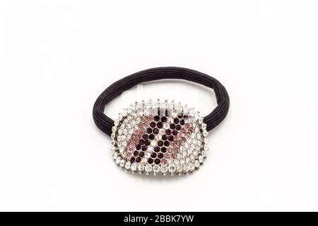 Hair elastic with a brooch set with stones on a white background Stock Photo