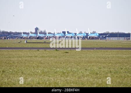 Amsterdam, Netherlands. 31st Mar, 2020. Airplanes of the Dutch airline KLM are parked at Schiphol airport in Amsterdam, the Netherlands, March 31, 2020. Air traffic is largely interrupted due to the coronavirus outbreak. Credit: Sylvia Lederer/Xinhua/Alamy Live News Stock Photo