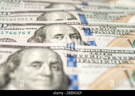 United States dollars. Pile of hundred USD banknotes. Photo with selective focus Stock Photo