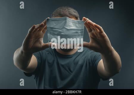 portrait of young man who try to put the breathing mask on Stock Photo