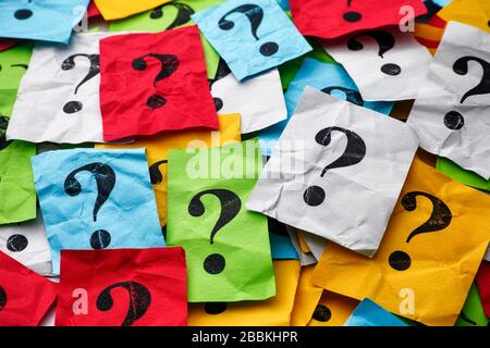 Heap of colorful paper notes with question marks. Closeup. Stock Photo