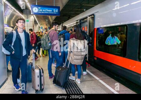 Vienna, Austria, People on Subway Platform, Boarding Austrian Train S-Bahn, Line S7, to Airport, teenage holidays, get on train, boarding train, Young adults on holiday Stock Photo