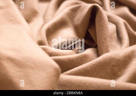 Cashmere texture background. Wool fiber material. Luxury pink textile. Stock Photo