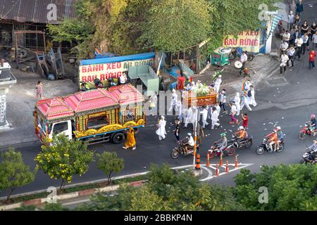 Pham Van Dong Street, Go Vap District, Ho Chi Minh City, Vietnam - February 15, 2020: A funeral is held in the traditional way on the street at Pham V Stock Photo