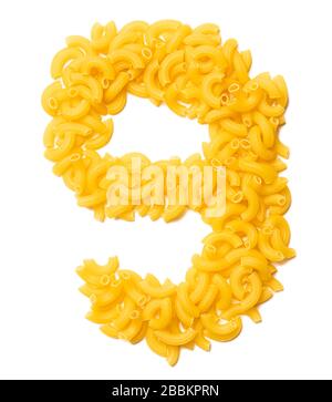 Arabic numeral '9'  from dry pasta on a white isolated background. Food pattern made from macaroni tubes. Bright alphabet for shops. Stock Photo