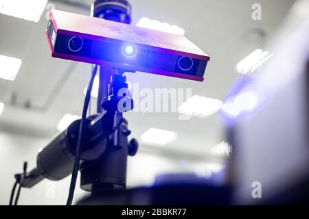 Professional 3D scanner scanning an industrial object plastic molding placed on a turntable, metrology concept Stock Photo
