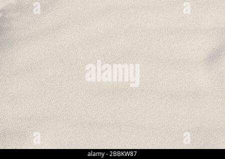 White sand texture and background. Sand on the the beach as background Stock Photo