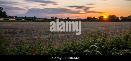 Sunset over the fields in Norfolk England Stock Photo