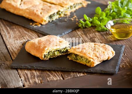 Homemade greek spanakopita pie with organic spinach Stock Photo