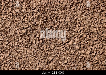 The surface of fresh brown asphalt on the road in detail. Stock Photo