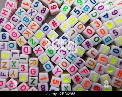 Set of plastic cubes with colored letters and numbers Stock Photo