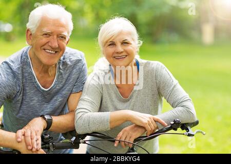 Senior couple on bicycles Stock Photo
