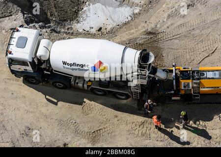 Wien, Vienna: work at construction site starts again after corona virus stop, ready-mix truck, truck mixer, worker, construction site 'Danube Flats', Stock Photo