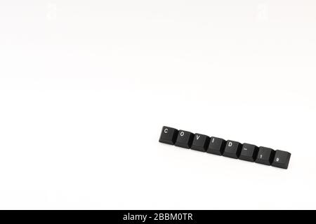 Letters of keyboard covid-19 coronavirus laid with black key caps on empty picture Stock Photo