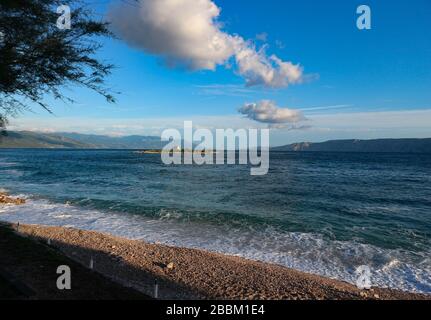 San Marino island and small chapel off the shore of Novi Vinodolski, at the croatian side of adriatic coast at sunset Stock Photo