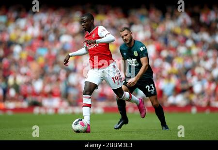 Arsenal's Nicolas Pepe (left) in action Stock Photo