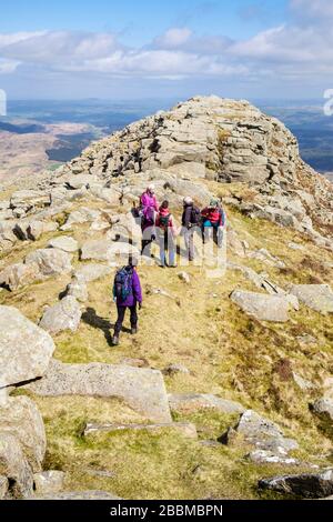 Hikers hiking on Carnedd Moel Siabod summit ridge in mountains of Snowdonia National Park, Capel Curig, Conwy, North Wales, UK, Britain Stock Photo