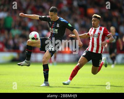 Sheffield United's Callum Robinson (right) and Crystal Palace's Martin Kelly battle for the ball