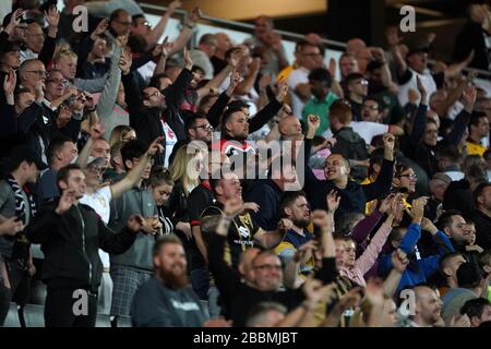 Milton Keynes Dons' fans celebrate winning the game Stock Photo