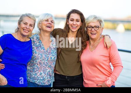 Group of women smiling outdoors Stock Photo