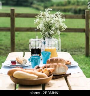 Glamping breakfast outdoors, eating alfresco. England Stock Photo