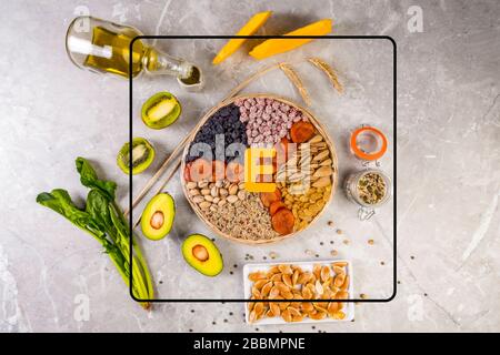 Food sources of vitamin E, high in antioxidants, anthocyanins, minerals and fiber, The concept of healthy food for brain and heart on concrete backgro Stock Photo