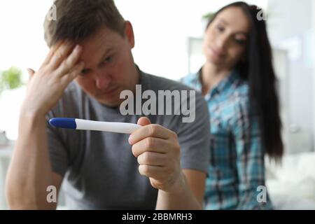 Man Rubs His Forehead Looking At Pregnancy Test Stock Photo Alamy man-rubs-his-forehead-looking-at-pregnancy-test-stock-photo-alamy