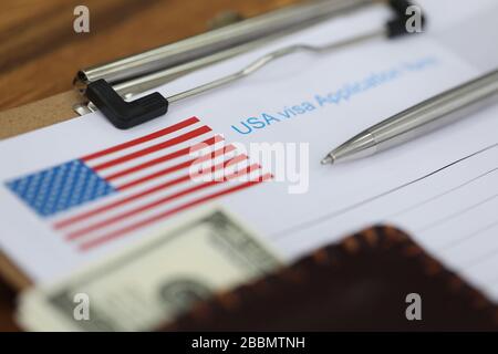 Silver pen lies national us visa application form Stock Photo