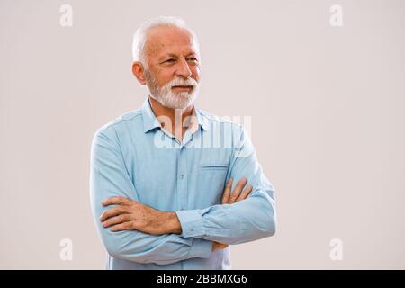 Portrait of senior man who is looking away. Stock Photo