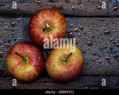 Top view of three red apples on table Stock Photo