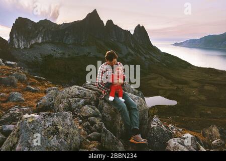 Father with baby infant outdoor family travel vacation in mountains healthy lifestyle man with child together adventure trip summer recreation Stock Photo