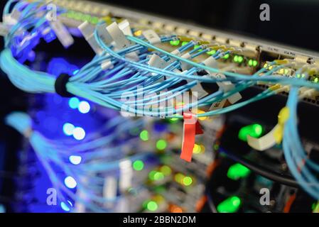 Working servers in data center with a lot of led lamps and cables Stock Photo