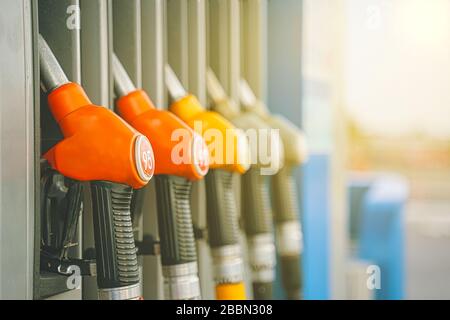 Gas station. Gas pump nozzles on the petrol station. Stock Photo