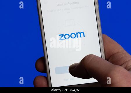Zoom video conferencing app on phone Stock Photo