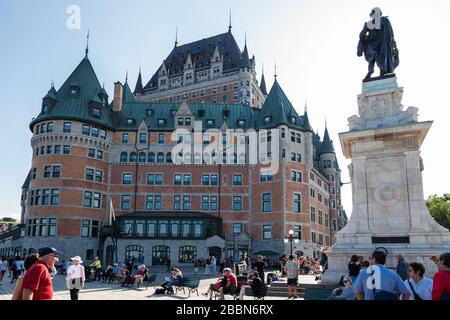 Fairmont Chateau Frontenac et Samuel de Champlain monument by a sunny summer time on the Terrasse Dufferin. Stock Photo