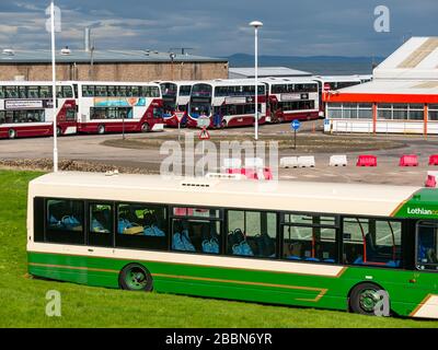 Edinburgh, Scotland, United Kingdom. 1st April 2020. Covid-19 Lockdown: With the significant reduction in bus services during the Coronavirus pandemic, the Lothian bus depot at Seafield is shut down with large numbers of buses parked in lines Stock Photo