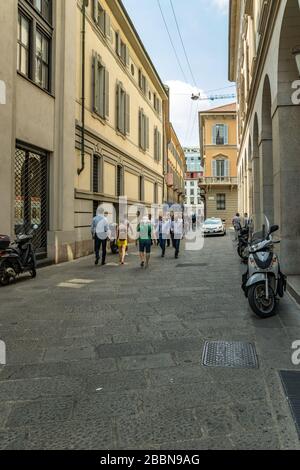 MILAN, ITALY - AUGUST 01, 2019: Tourists and locals walk in the center of Milano. Shops, boutiques, cafes and restaurants. Stock Photo