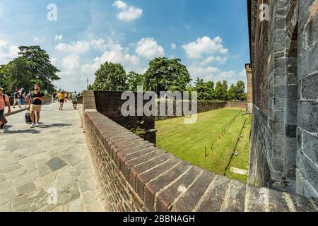 MILAN, ITALY - Aug 1, 2019: People visiting the Sforza Castle XV century - Castello Sforzesco. It is one of the main symbols of the city of Milan, Lom Stock Photo