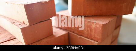 Building materials are on floor, stack red bricks Stock Photo