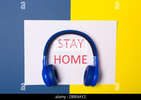 Top view of words stay at home. Minimal concept. Stay safe, concept of self quarantine at home as preventative measure against virus outbreak. Social Stock Photo