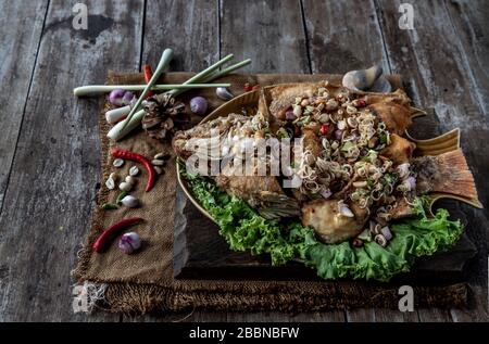 Deep fried whole Tubtim fish with spicy lemongrass salad, Thai food for ...