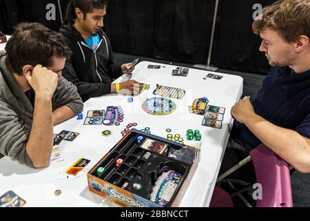 People playing at “Seasons” at the game and toy fair of Quebec City - La Revanche, board game, ExpoCité fair center. Stock Photo